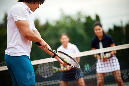 Preview: Fit happy poeple playing tennis together. Sport concept