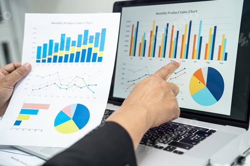 Preview: Asian accountant working and analyzing financial reports project accounting with graph