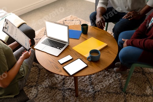 Preview: African american senior couple meeting with asian financial advisor using laptop with copy space