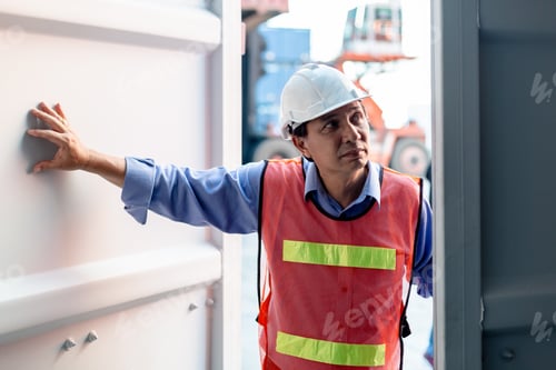 Preview: Foreman safety helmet checking containers in cargo ship, Industrial container cargo concept.