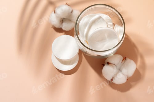 Preview: Cotton discs for skincare in a jar on paper background