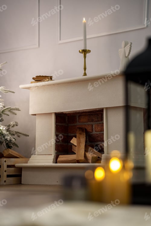 Preview: Cozy interior with a candlelit mantelpiece and stacked firewood in a brick fireplace