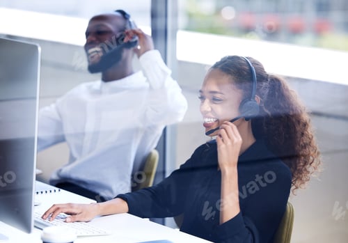Preview: Shot of a young businesswoman working in a call centre
