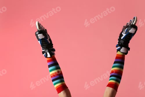 Preview: Woman with roller skates on color background, closeup
