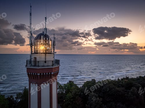Preview: Aerial view of lighthouse with light by Baltic Sea, Poland.