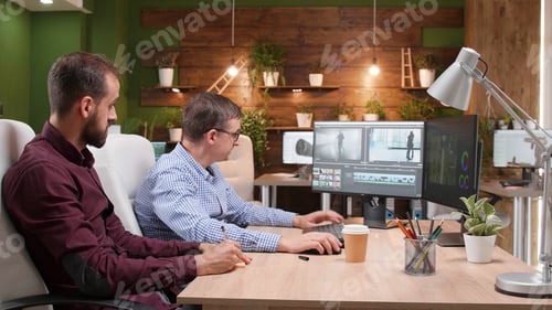 Preview: Team of video editors analyzing film montage after editing visual effects