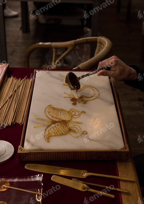 Preview: chines art, making fugures from melted caramel
