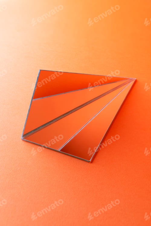Preview: Triangle shaped mirrors onorange background