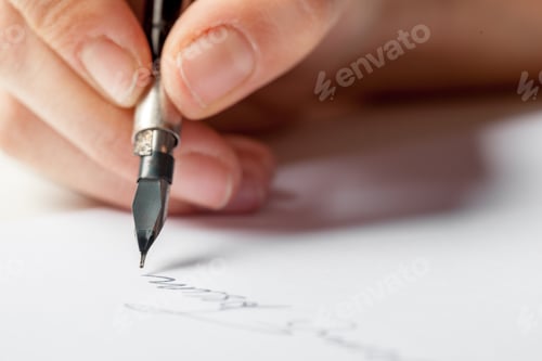 Preview: Person writes with a pen on paper exploring 5G internet technology ideas in a quiet space