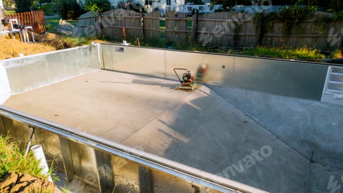 Preview: Laying construction of the swimming pool in the garden of the family house.