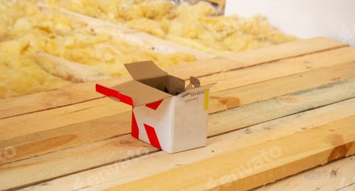 Preview: the man twists the screws into the board. Repair of the floor in the house.