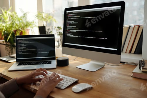 Preview: Hans of young female programmer or IT manager typing on computer keyboard