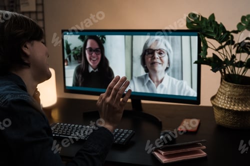 Preview: Multi generational business women having video call with her colleagues using computer app