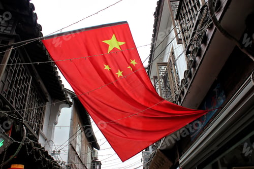 Preview: The flag of China hanging in an ancient alleyway