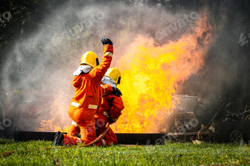 Preview: Firefighter Concept. Fireman using water and extinguisher to fighting with fire flame.