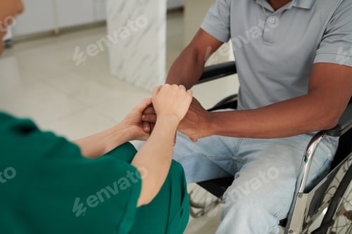 Preview: Patient Holding Hands of Nurse