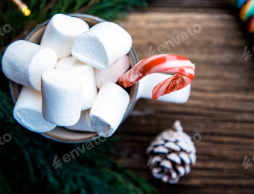Preview: hot Christmas drink with marshmallow on wooden table