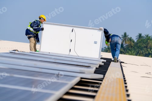 Preview: workers installing solar panels, for efficient energy on rooftop