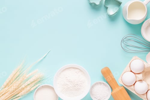Preview: Ingredients for baking on light blue background.