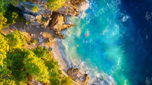 Preview: Drone view of the sea coast. Rocky shore and sea water. Vacation and travel.