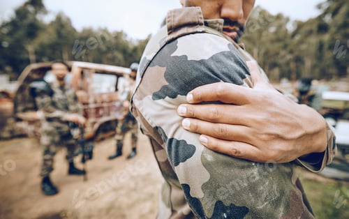 Preview: Injury, paintball and arm pain by man on field for team sport, fitness or training outdoor. Shoulde