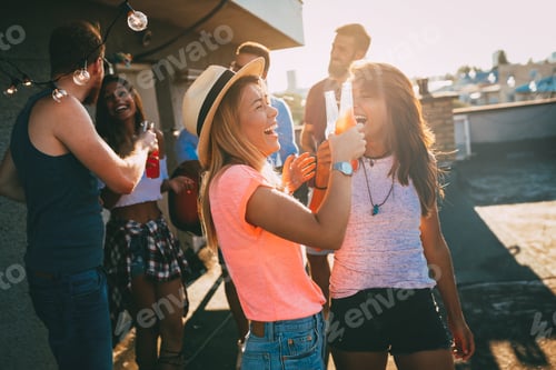Preview: Happy young girls having fun at party