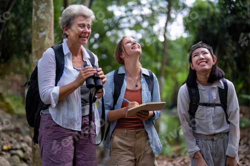 Preview: Backpack tourist travel outdoor adventure bird study using binoculars looking and record to book