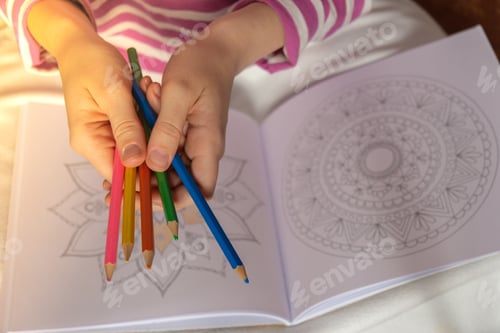 Preview: Female painting mandalas antistress page to combat stress. Relaxing hobby mental wellbeing and art