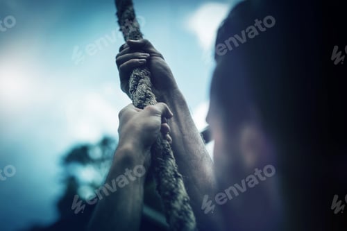 Preview: Man climbing a rope during obstacle course