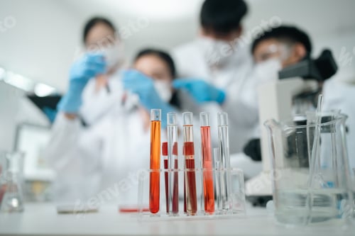 Preview: Medical research teamwork in laboratory using microscope and blood test tubes for DNA analysis