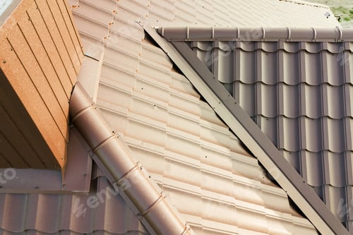 Preview: Detail of house roof structure covered with brown metal tile sheets