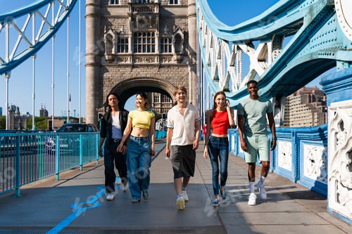 Preview: Multiracial group of happy young friends bonding in London