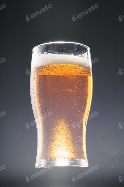 Preview: Glass of beer on black background, copy space