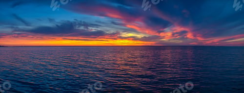 Preview: Beautiful sunset over the water surface