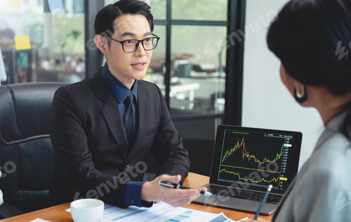 Preview: Group of Asian business people meeting about business plan and present and explain stock financial