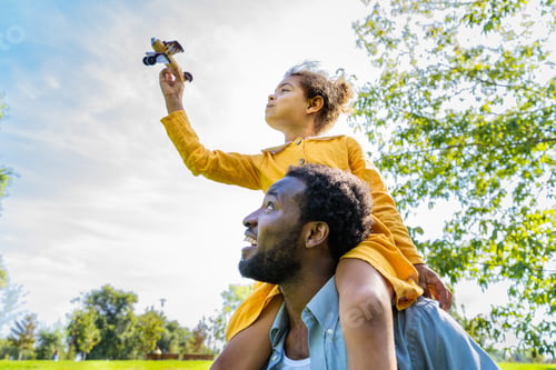 Preview: Beautiful happy african american family bonding at the park