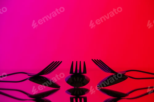 Preview: front view metal forks on pink background cutlery kitchen food color photo table dinner restaurant
