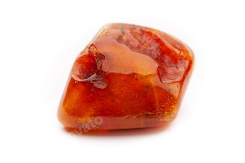 Preview: Natural amber. A piece of yellow opaque natural amber on white background