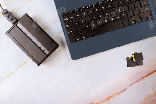 Preview: External hard disk and keyboard laptop computer transfer photos to SD cards