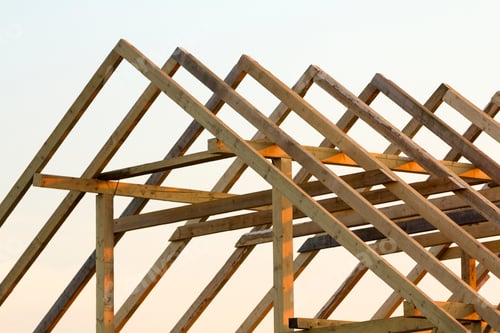 Preview: Close-up of attic roof frame against clear sky from inside. Ecological dream home