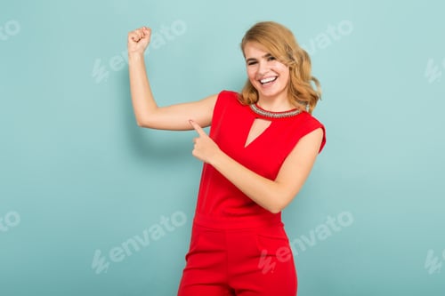 Preview: Smiling Woman Flexing and Pointing to Bicep