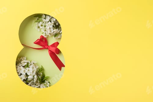 Preview: 8 March greeting card. Paper cut Eight made of yellow background and fresh spring flowers bouquet of