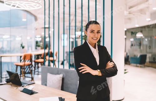 Preview: Smiling woman in formal wear at workplace