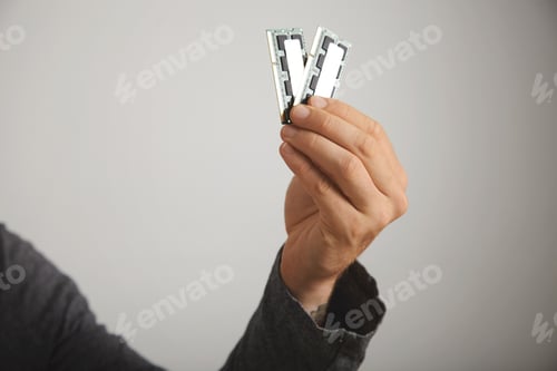 Preview: Man's hand holding RAM