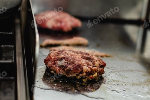 Preview: Some patties of ground meat with bacon