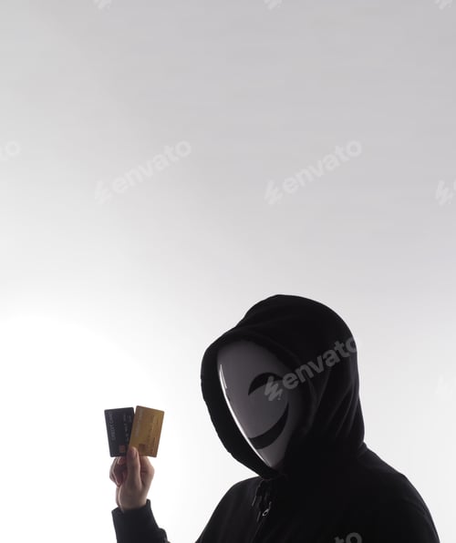 Visualização: Credit cards personal data stolen by anonymous man in Black hood shirt.