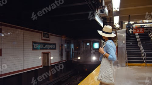 Preview: Young girl waiting for a train in the subway