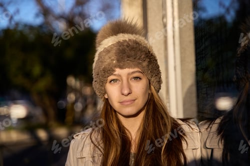 Preview: portrait of a serious woman with a hat looking at the camera and copy space for text