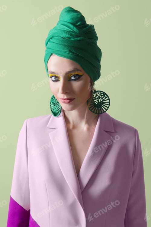 Preview: Pretty fashion model in bi color jacket and turban on head
