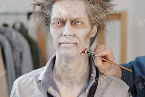 Preview: Young businessman with zombie makeup